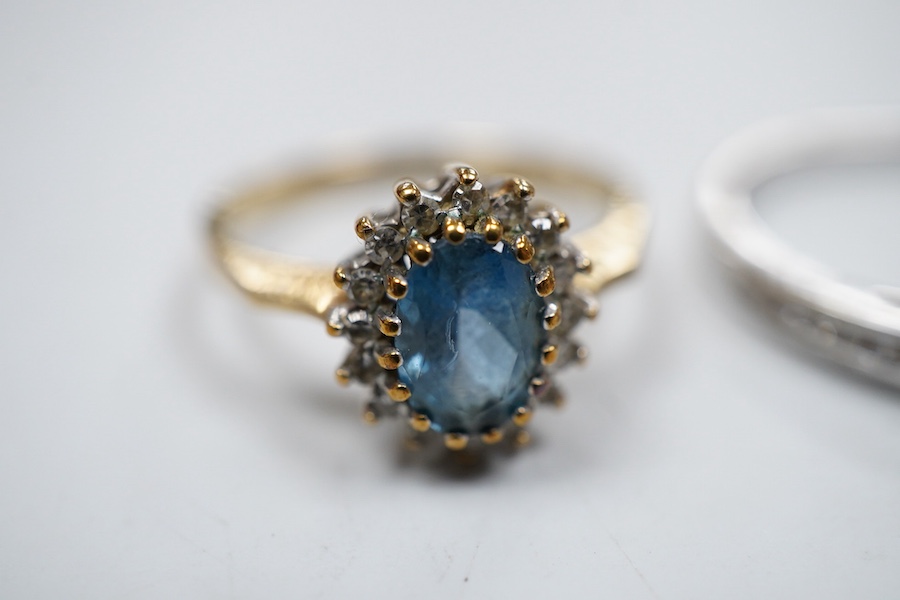 A collection of three rings, comprising: a ring, set with a brilliant-cut diamond weighing approximately 0.20 carats, to shoulders set with smaller brilliant-cut diamonds totalling approximately 0.16 carats, mounted in 9